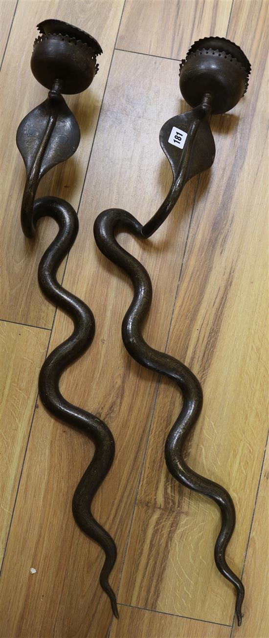 A pair of Benares cobra wall sconces